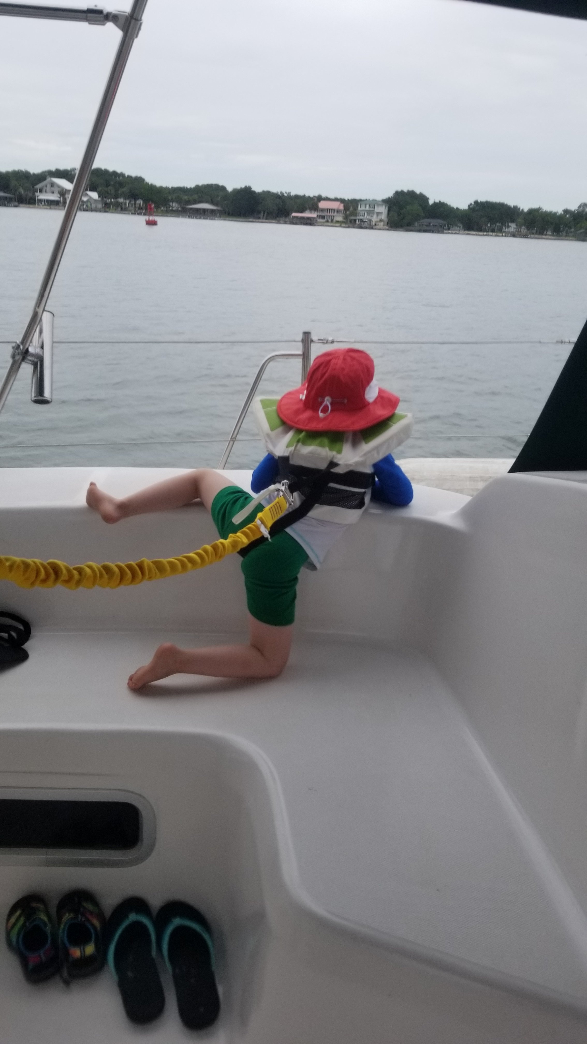 keeping watch, boat kid